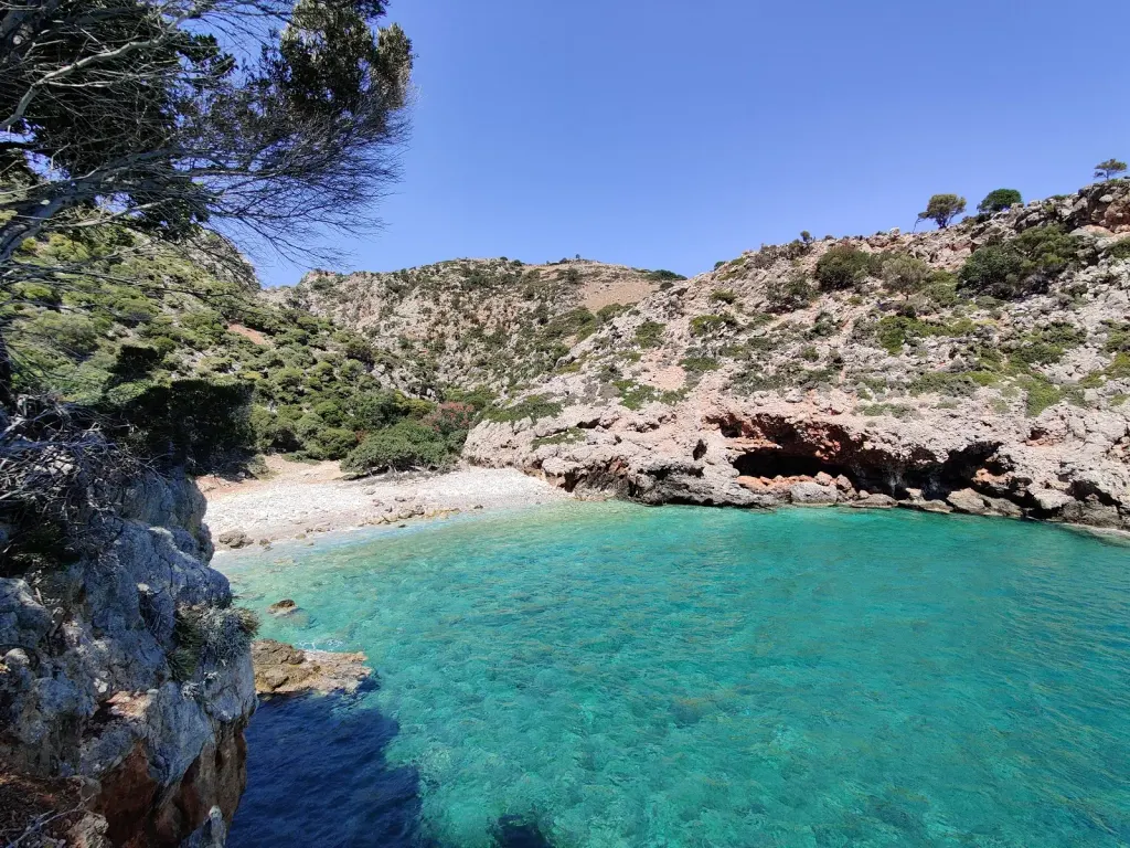The stretch of fine white sand and crystal clear Aegean waters at Ramyas beach, Crete.